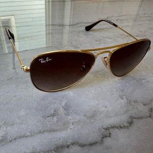 Kids Aviator Ray Ban sunglasses.